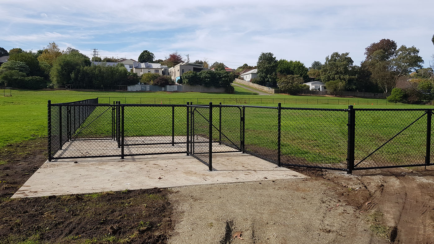 Brooker Park Warragul dog park black chain mesh fencing along grass reserve