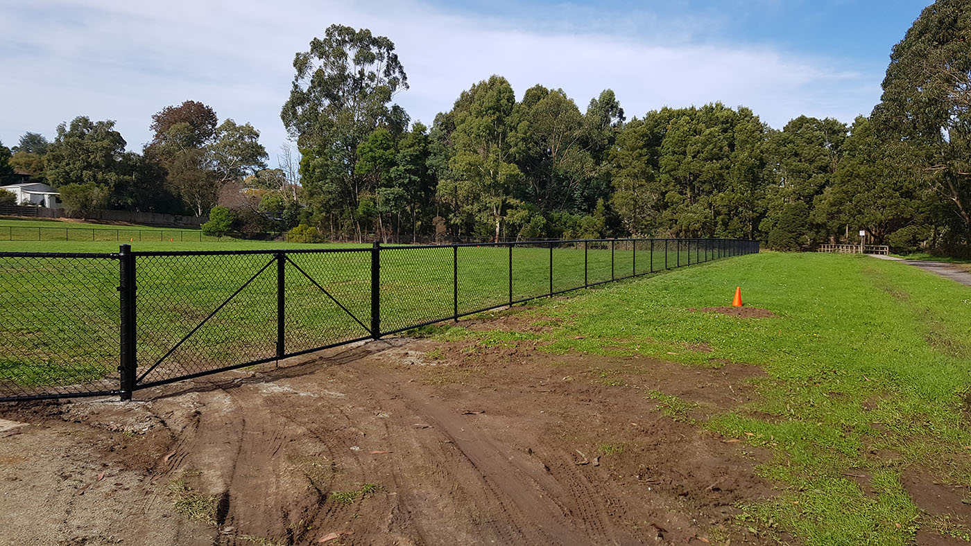Brooker Park Warragul dog park long black chain mesh fence line beside open reserve
