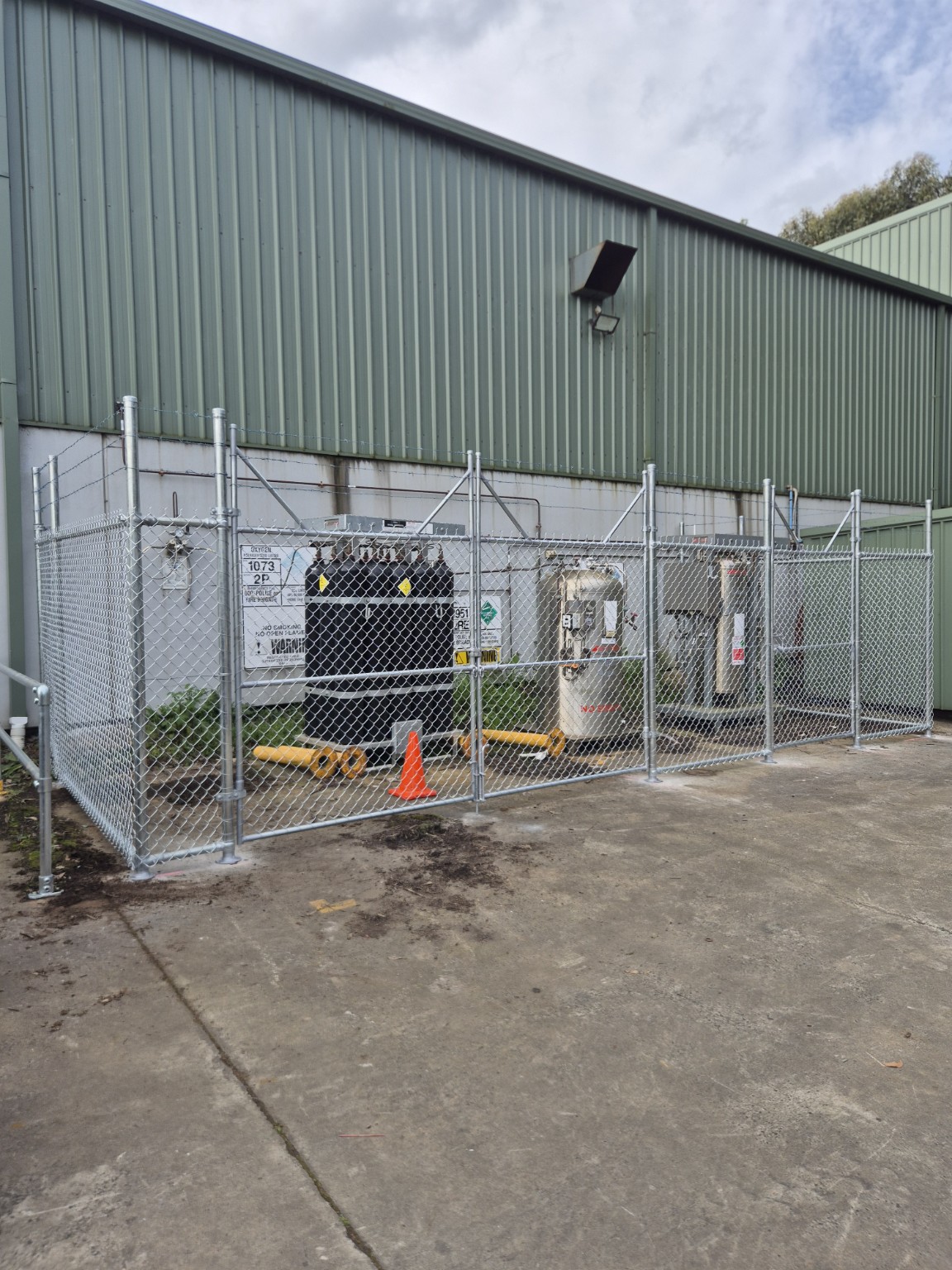 Completed galvanised security cage and access gates around gas assets at Burra Sheetmetal in Korumburra