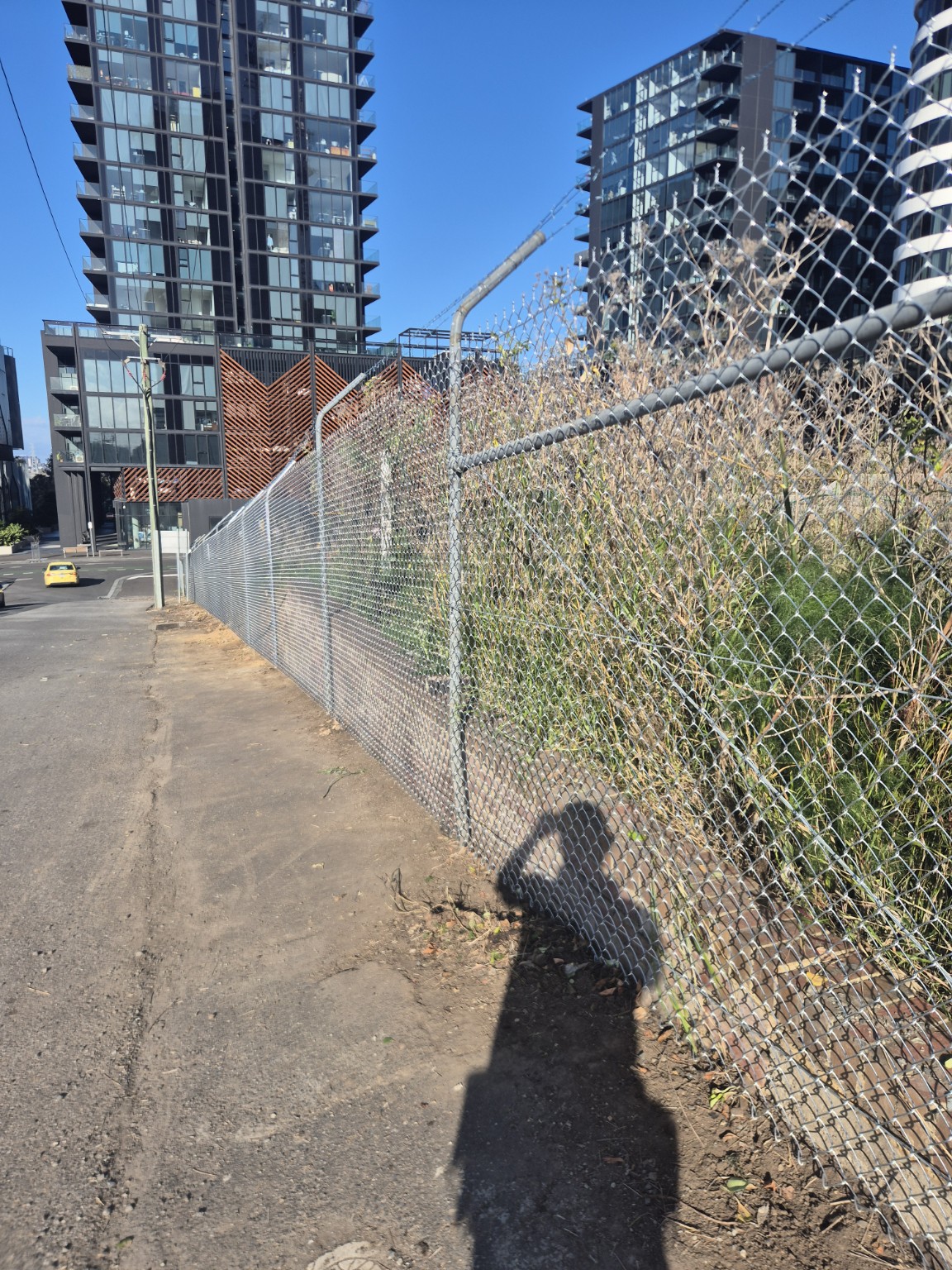 View along the new galvanised chain mesh and barbed wire at the Growland Footscray site