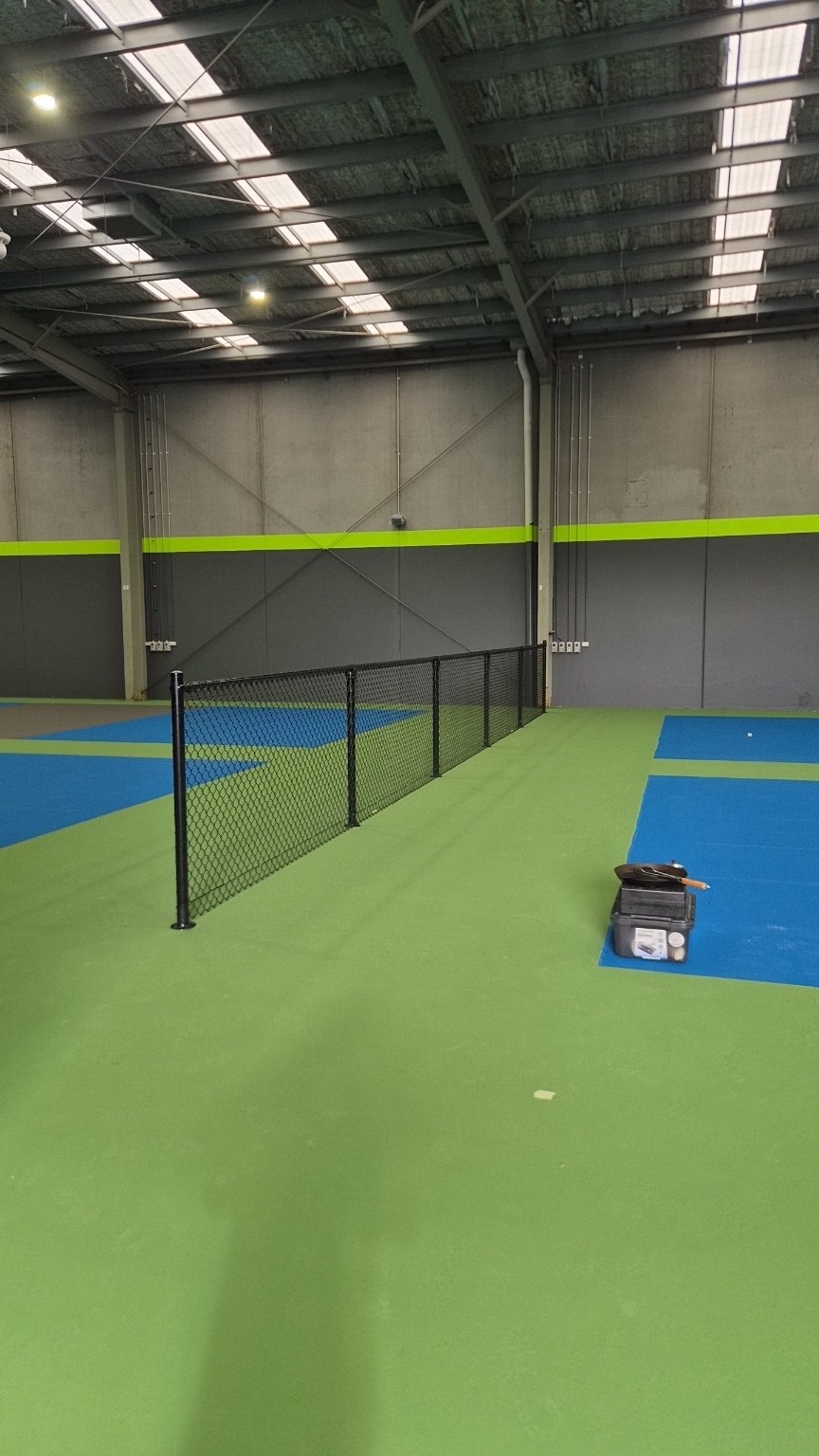Finished 1200mm high black chain mesh divider between the Pickle Zone courts