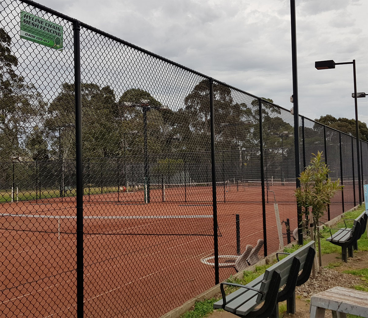 Schools and sports facilities fencing at a school entrance