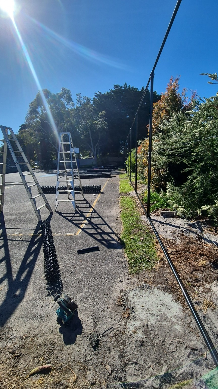 Black posts, top and bottom rails and helicoil cables ready for chain mesh installation