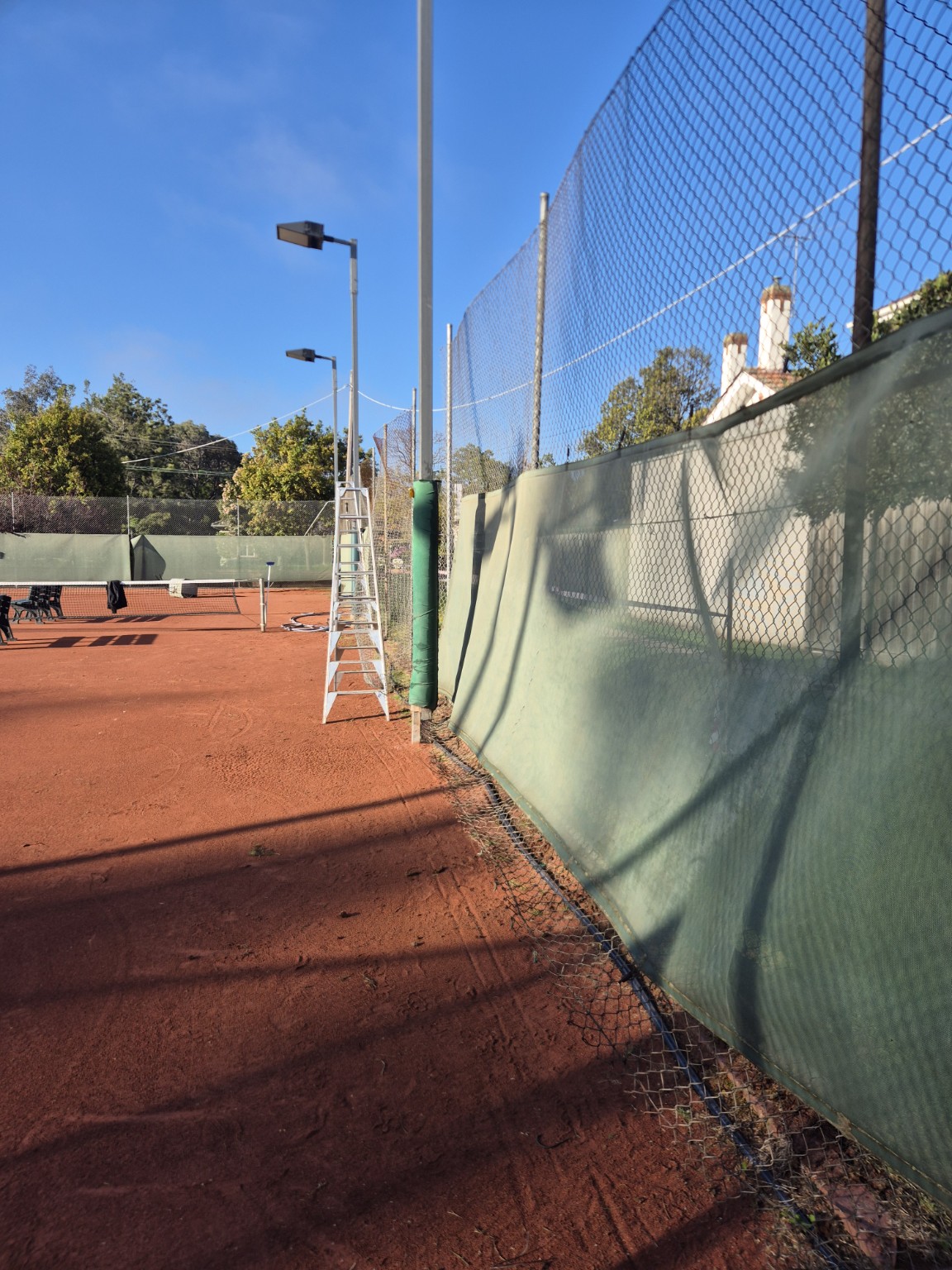 Original galvanised chain mesh and windscreen beside the tennis courts before the Willison Park renovation
